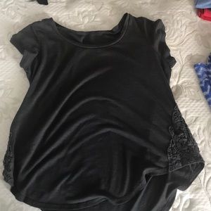 grey shirt with pattern on the side